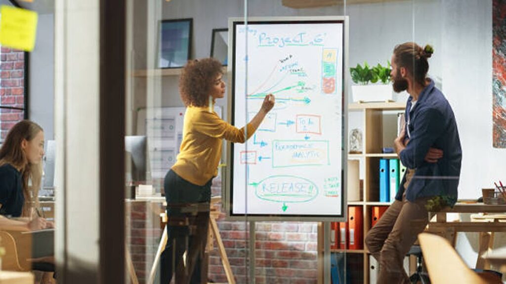 portrait-of-a-beautiful-successful-businesswoman-making-a-team-presentation