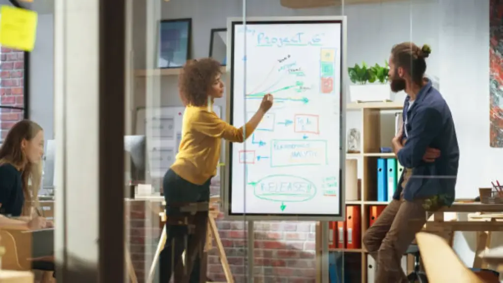 portrait-of-a-beautiful-successful-businesswoman-making-a-team-presentation