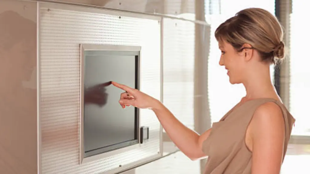 Businesswoman In Conference Room Using Touch Screen