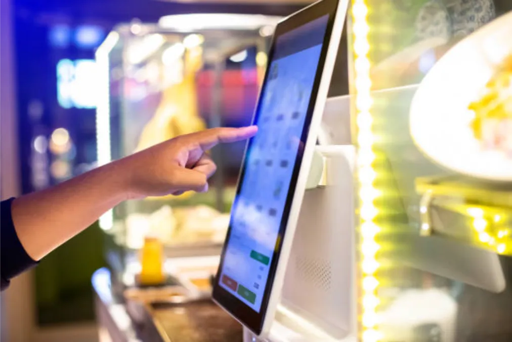 Selective Focus To Customer's Hand Is Touching A Touch Screen To Order Food And Pay Electronically