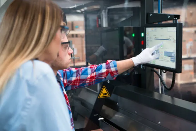 A Man Using Industrial Touch Screen