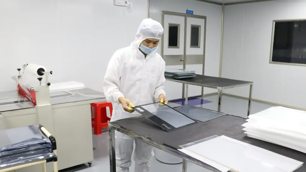 Worker Checking Touch Screen Monitor